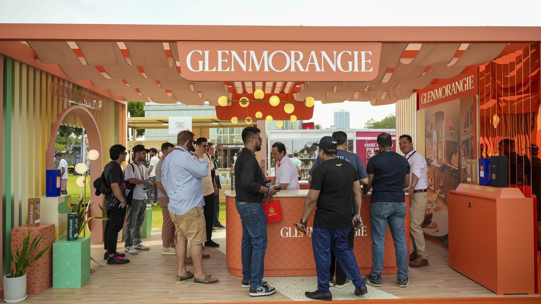 Guests gathered along the Glenmorangie bar