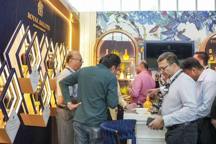 Guests tasting inside a decorated brand pavilion