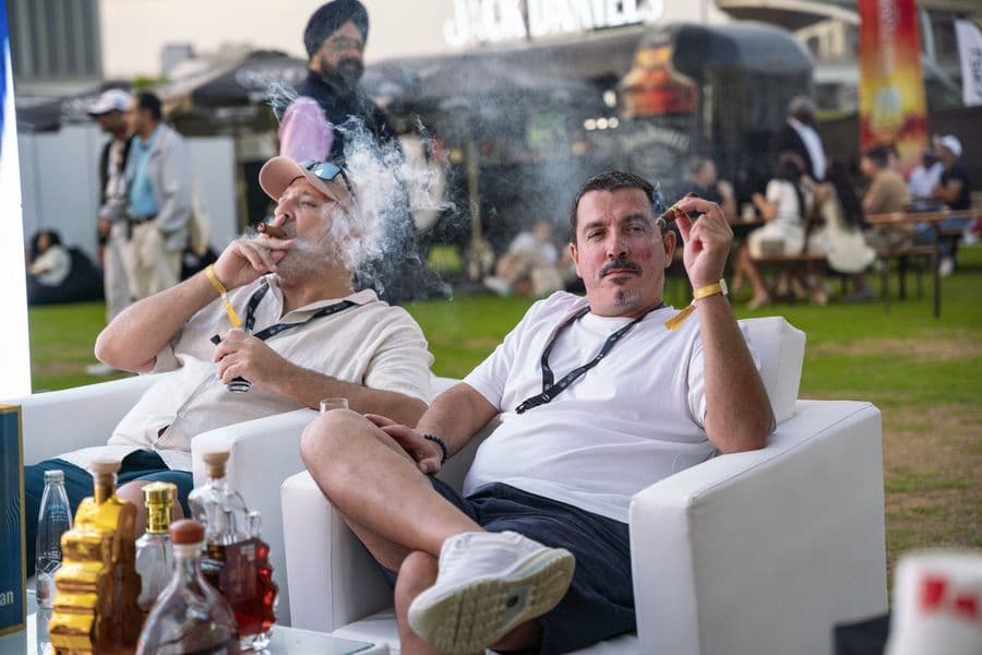 Guests relaxing with cigars on the lounge sofas