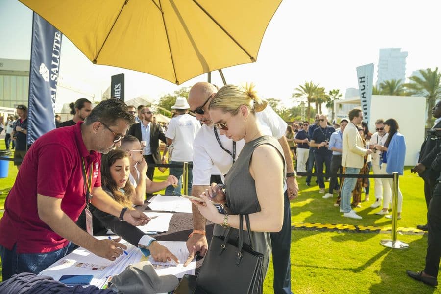 Guests being registered at a judging table