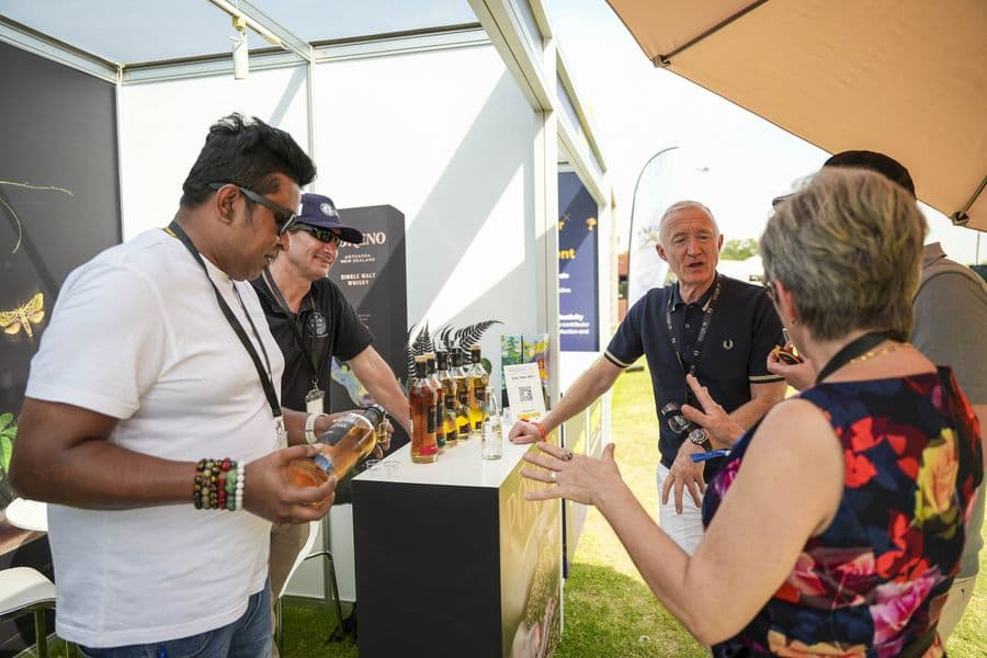 Visitors tasting at a brand stand