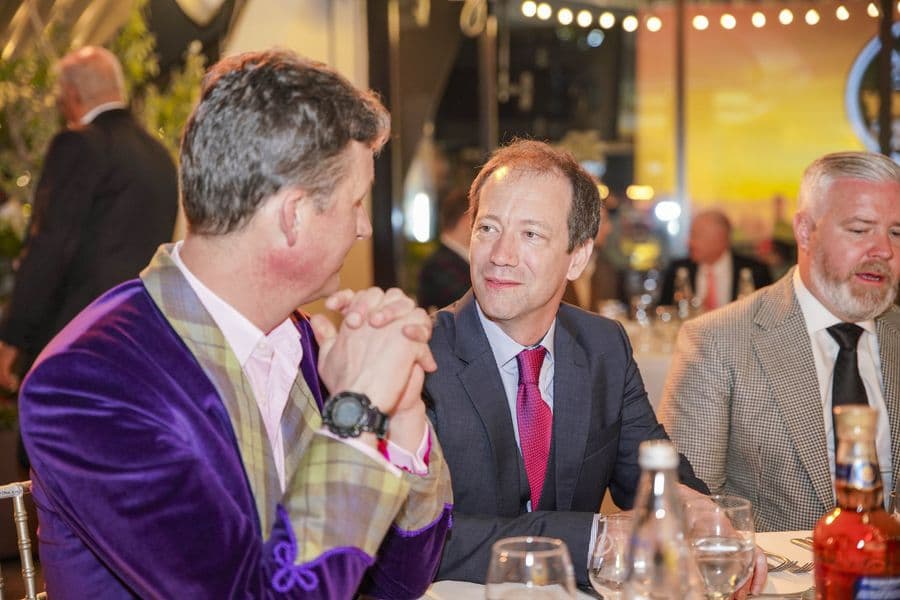 Two guests in conversation at the gala