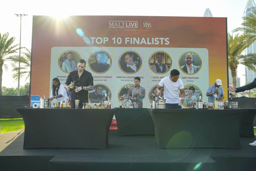 The top ten finalists board on the main stage screen