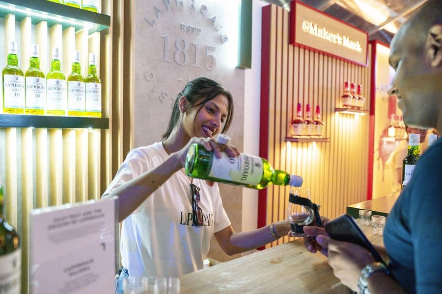 A bartender pouring at the Bushmills stand