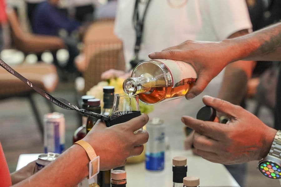A close pour of whisky at a brand stand