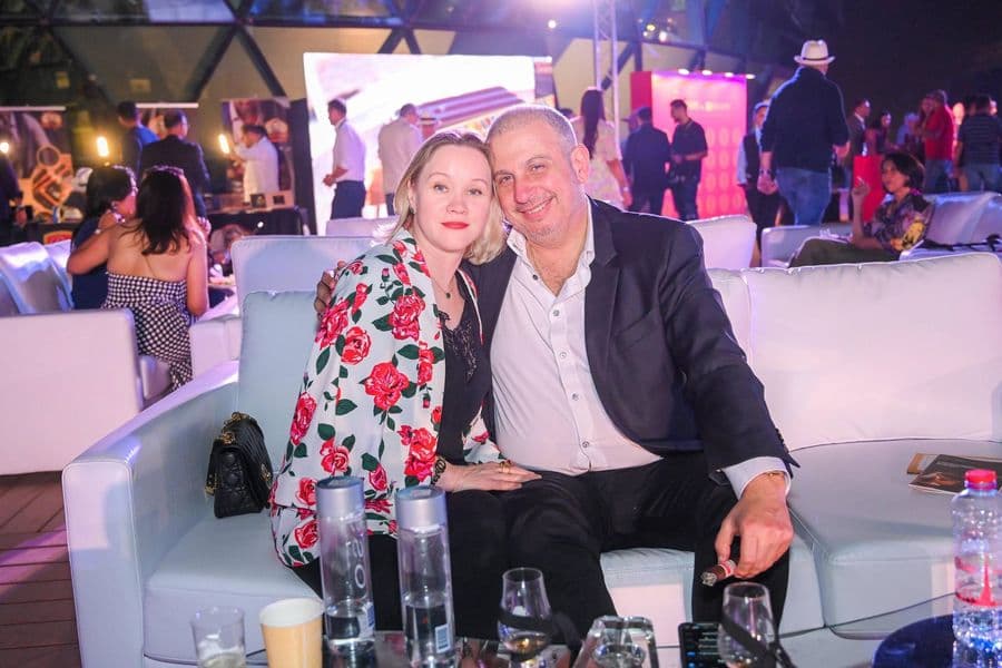 Two guests seated together on the lounge sofas