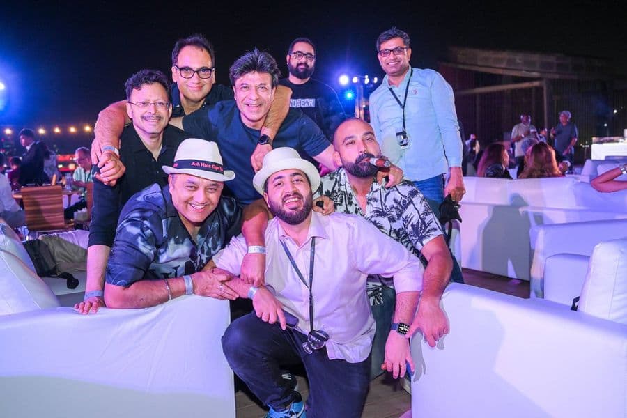 Friends together in front of the stage