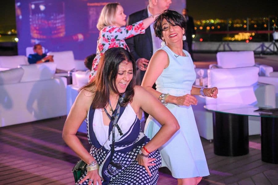 Two guests photographed on the terrace