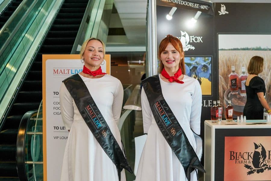 MaltLive hosts welcoming guests at the entrance