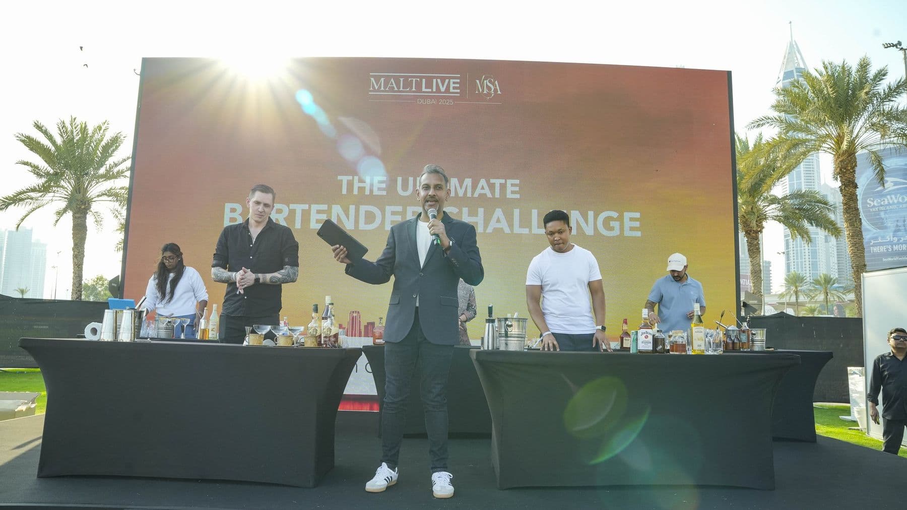 A host addressing the crowd from the masterclass stage