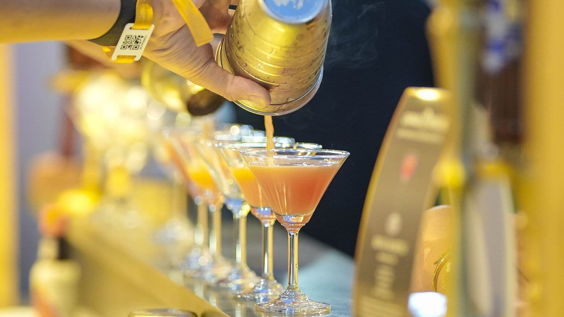 Cocktails being drawn from brass taps at the cocktail bar